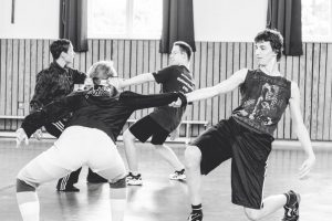 four dancers are playing on their weight